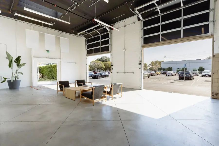 The Garage, an open space with a roll-up door to the parking lot